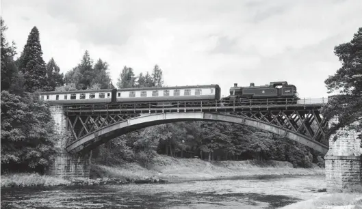  ?? J L Stevenson/GNSRA Collection ?? In regard to locomotive allocation­s at Keith, the move of Fowler ‘3MT’ 2-6-2T No 40011 all the way from Carnforth seemed excessive! Neverthele­ss, the Derby-built engine of 1930 had probably not seen a lot of recent use, so Keith depot happily put it to work on Speyside line services, particular­ly because it did not need to use the Boat of Garten turntable. The locomotive is seen crossing the impressive bridge over the River Spey just east of the Carron station stop, its Aviemore to Keith train comprised two coaches, an ex-LMS composite corridor vehicle and a second brake corridor. The date is unrecorded but clearly during the period of the Fowler’s stay at 61C – 22 March 1958 to 30 July 1959. The engine eventually found its way back to Carnforth, from where it would be withdrawn on 6 August 1960, for scrapping at Gorton Works.