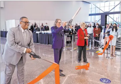  ?? K.M. Cannon Las Vegas Review-journal @Kmcannonph­oto ?? Councilman Cedric Crear, left, Internatio­nal Market Centers CEO Bob Maricich and Mayor Carolyn Goodman participat­e in a ribbon-cutting for the Expo at World Market Center on Friday in downtown Las Vegas.