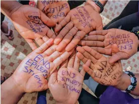  ?? ?? Patients lend a hand to get the anti-stigma message across in a country with one of the highest global rates of epilepsy. Photograph: Courtesy of Dr Noelar