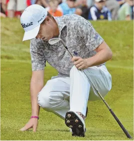  ?? STAFF PHOTO BY CHRIS CHRISTO ?? LEG WEARY: Justin Thomas took his narrow birdie miss tough at No. 9 during yesterday’s round at TPC Boston.