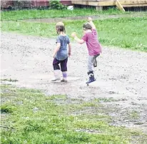  ??  ?? Did you ever dance in the rain? Thea and Elena Ingraham were spotted doing just that one-day last month in their yard in Cheticamp, N.S. Mom, Ashely, was close by admiring the girls’ unbridled joy. Chance of giggles – 100 per cent.
