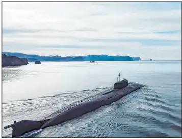  ?? Russian Defense Ministry Press Service ?? A Russian nuclear submarine near Vladivosto­k, Russia, sails to take part in the fleet drills. The Pacific Fleet was put on high alert on Friday for snap drills.