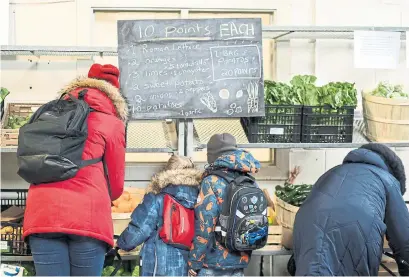  ?? ANDREW FRANCIS WALLACE TORONTO STAR FILE PHOTOS ?? Daily Bread Food Bank has seen demand skyrocket during the pandemic. CEO Neil Hetheringt­on says before COVID-19, the organizati­on saw about 60,000 clients each month — a number that has doubled in the 19 months since the pandemic began.