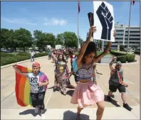  ?? (Arkansas Democrat-Gazette/Thomas Metthe) ?? Drag queens and kings lead a Black Lives Matter protest up the steps of the state Capitol in Little Rock on Sunday. More photos at arkansason­line.com/615protest/.