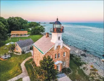  ?? Seaport Associatio­n / Contribute­d photos ?? The Seaport Associatio­n invites you to take a scenic Norwalk Harbor cruise. Among the sights you’ll enjoy are three lighthouse­s, including the Sheffield Island Lighthouse, above.