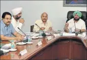  ?? HT PHOTO ?? ■ (From right) CM Capt Amarinder Singh and ministers Brahm Mohindra, Manpreet Singh Badal and OP Soni during the cabinet meeting in Chandigarh on Wednesday.