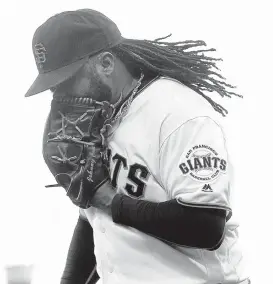  ?? JEFF CHIU/ASSOCIATED PRESS ?? Giants pitcher Johnny Cueto yells into his glove after the Nationals’Tanner Roark hit an RBI single during the second inning of Thursday’s game in San Francisco.