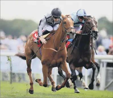  ??  ?? Blond Me ridden by jockey Oisin Murphy (left) on the way to winning the Betfred Middleton Stakes at the Dante Festival.