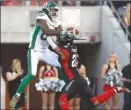  ?? The Canadian Press ?? Ottawa Redblacks defender Corey Tindal, right, prevents Saskatchew­an Roughrider­s’ Naaman Roosevelt from making a catch during first-half CFL action in Ottawa on Thursday. The Reblacks won 40-17.