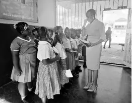  ?? ?? Portsmouth Primary School students interact with Education Minister Fayval Williams at a function to award them for excellence, held on November 16.