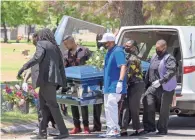  ??  ?? Family and friends came to pay respects during the funeral for Dion Johnson. Johnson was shot and killed by an Arizona state trooper on May 25.