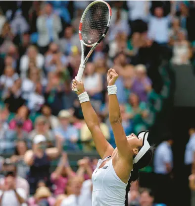  ?? ALASTAIR GRANT/AP ?? Britain’s Heather Watson celebrates defeating Slovenia’s Kaja Juvan in the third round of Wimbledon on Friday in London.