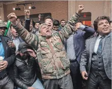  ?? CHRIS YOUNG THE CANADIAN PRESS ?? Supporters of Brampton mayoral candidate Patrick Brown react as early results are shown on a screen at a campaign event on Monday.