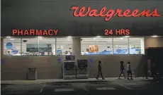  ?? Rogelio V. Solis / Associated Press 2013 ?? FedEx service initially will be available in a few dozen Walgreens stores this spring, then the program will gradually expand.