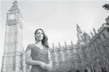  ??  ?? British activist Nicola Thorp, outside the Houses of Parliament in London, complained that her employment agency required “regularly reapplied” makeup and shoes with at least a five-centimetre heel while she was working at a finance firm.