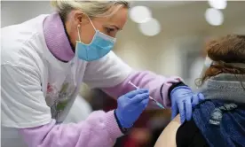  ?? Photograph: Jed Leicester/ REX/Shuttersto­ck ?? A doctor administer­s the Covid-19 Pfizer vaccinatio­n for local residents in London. It is one of a number of successful candidates in the UK’s portfolio.