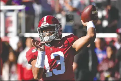  ?? The Associated Press ?? GET READY: Alabama quarterbac­k Tua Tagovailoa (13) warms up before last Saturday’s game against LSU in Tuscaloosa, Ala.