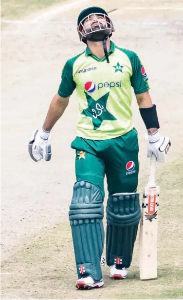  ?? Agence France-presse ?? Pakistan’s Mohammad Rizwan celebrates after scoring a half-century against Zimbabwe during their first Twenty20 match at the Harare Sports Club in Harare on Wednesday.