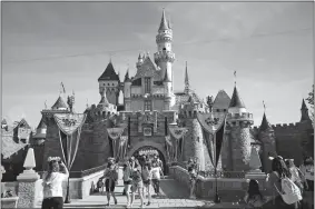  ?? JAE C. HONG/AP FILE PHOTO ?? The Sleeping Beauty Castle is seen at Disneyland in Anaheim, Calif., in April 2021. Theme park designer Rolly Crump was instrument­al in the early design of Disneyland.