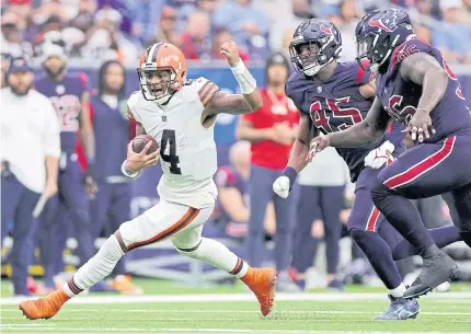  ?? AFP ?? The Browns’ Deshaun Watson runs with the ball against the Texans at NRG Stadium in Houston.