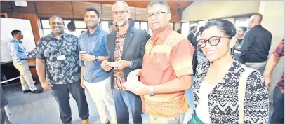  ?? Picture: ELIKI NUKUTABU ?? Governor Reserve Bank of Fiji Ariff Ali (fourth from left) is joined by Financial Intelligen­ce Unit’s Director Razim Buksh and other guests at the launch of the Central Securities Depository in Suva,
yesterday.