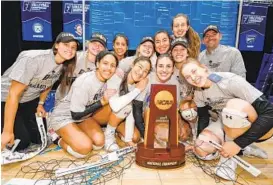  ?? JACK DEMPSEY/NCAA PHOTOS VIA GETTY ?? Johns Hopkins celebrates after winning the Division III women’s volleyball championsh­ip 3-0 against Emory on Nov. 23 at the U.S. Cellular Center in Cedar Rapids, Iowa.