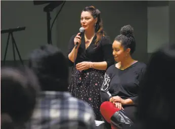  ?? Photos by Paul Chinn / The Chronicle ?? Jessa Brie Moreno (left) and Mariah Rankine-Landers share the curriculum for “Rise Up! Disrupting the Master Narrative” for high school students.