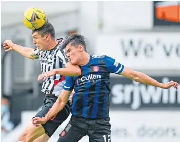  ?? ?? Dunfermlin­e’s Nikolay Todorov and Hamilton’s Shaun Want in a mid-air tussle