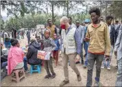  ?? ZERIHUN SEWUNET / UNICEF VIA AP ?? Manuel Fontaine, UNICEF Director of the Office of Emergency Programmes, center, visits internally­displaced people in Adigrat Town, in the Tigray region of northern Ethiopia Feb. 22.