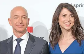  ?? (AFP) ?? A file photo shows Jeff Bezos (left) with his wife MacKenzie Bezos