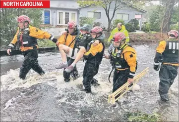  ??  ?? NORTH CAROLINA (In North Carolina, clockwise) Search and rescue workers rescue a man from floods caused by Hurricane Florence in River Bend; A man and his kitten, Survivor, rescued from floodwater­s in New Bern; Volunteers from across the US help rescue residents from their flooded homes in New Bern.