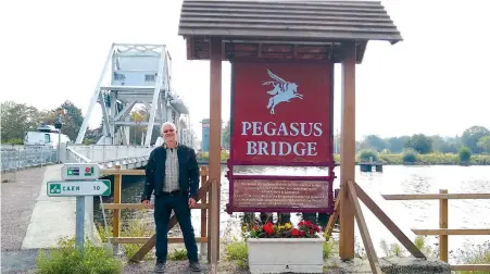  ??  ?? THE WRITER at the famous Pegasus Bridge, captured by the British on D-Day.
