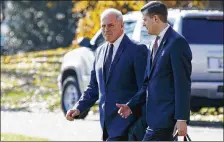  ?? EVAN VUCCI / ASSOCIATED PRESS ?? White House Chief of Staff John Kelly (left) walks with White House staff secretary Rob Porter to board Marine One on the South Lawn of the White House in Washington.