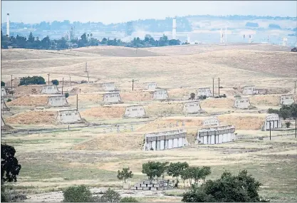  ?? STAFF FILE PHOTO ?? A view of ammunition bunkers is seen during a community and city employee tour of the former Concord Naval Weapons Station in May. The U.S. Navy is considerin­g housing up to 47,000 detained immigrants in a tent city at the base, according to a report disclosed Friday.