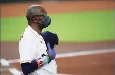  ?? Karen Warren / Houston Chronicle ?? Astros manager Dusty Baker during the national anthem before a Sept. 16 game against the Rangers.