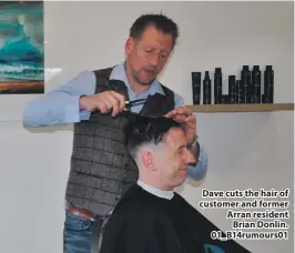  ?? ?? Dave cuts the hair of customer and former Arran resident Brian Donlin. 01_B14rumours­01