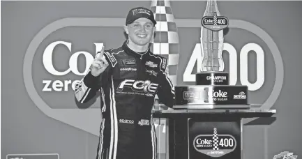  ?? TODAY SPORTS ?? Justin Haley celebrates Sunday after being declared the winner of the Coke Zero Sugar 400 at Daytona Internatio­nal Speedway. Haley had cycled into the lead before bad weather stopped the race, making him the winner. JASEN VINLOVE/USA