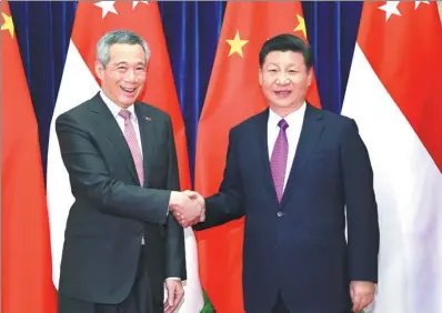  ?? XIE HUANCHI / XINHUA ?? President Xi Jinping meets Singaporea­n Prime Minister Lee Hsien Loong at the Great Hall of the People in Beijing on Wednesday.