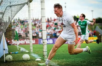  ??  ?? SCREAMER: Kildare’s Neil Flynn roars after scoring a goal for his in-form Kildare team against Fermanagh yesterday