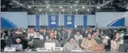  ?? AP ?? Attendees listen to a review of the state of discussion­s at the COP27 summit on Friday.