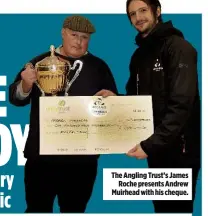  ??  ?? The Angling Trust’s James Roche presents Andrew Muirhead with his cheque.