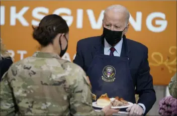  ?? EVAN Vucci / AP ?? President biden serves dinner during a visit to soldiers to mark Thanksgivi­ng on monday in Fort bragg, n.c.