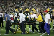  ?? JEFF HAYNES — AP FILE ?? Green Bay Packers running back Jamaal Williams (30) gives a thumbs-up while leaving the field on a stretcher Thursday after a hit by Eagles’ defensive end Derek Barnett, who is likely to be fined for the hit.