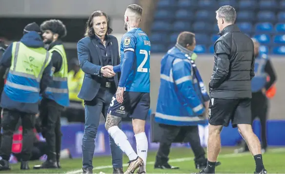  ?? ?? Ex-Wycombe Wanderers manager Gareth Ainsworth shakes hands with Posh star Joe Ward after the Chairboys’ 3-0 win at London Road on New Year’s Day. Photo: Joe Dent/theposh.com.