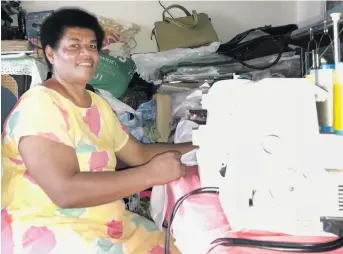  ??  ?? Makereta Navunicagi working on her new overlockin­g machine she purchased using the $1000 grant at her home in Nadera on January 24, 2018.