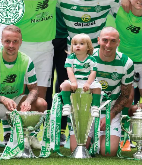  ??  ?? Leigh Griffiths, Scott Brown and Scott Sinclair at Celtic Park with their trophy haul (Picture: PA)