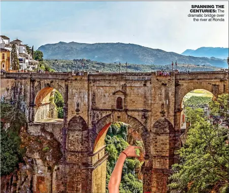  ??  ?? SPANNING THE CENTURIES: The dramatic bridge over the river at Ronda