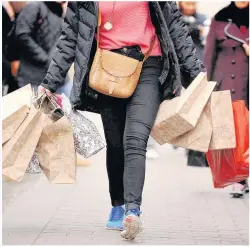  ??  ?? > A sixth of Christmas shoppers will still be making last-minute buys up until Christmas Eve