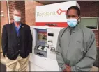  ?? Brian A. Pounds / Hearst Connecticu­t Media ?? Leon Standly, left, and Kenneth Moss at the Key Bank on Canal Street in Stamford on Oct. 12. Standly, a Pacific House Shelter resident, helped Moss get a hassle free account at the bank after developing a relationsh­ip with a bank manager.