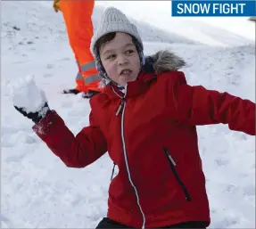  ??  ?? Sol Jackson enjoying a snowball fight at the Upper Dam at the Vartry Reservoir.